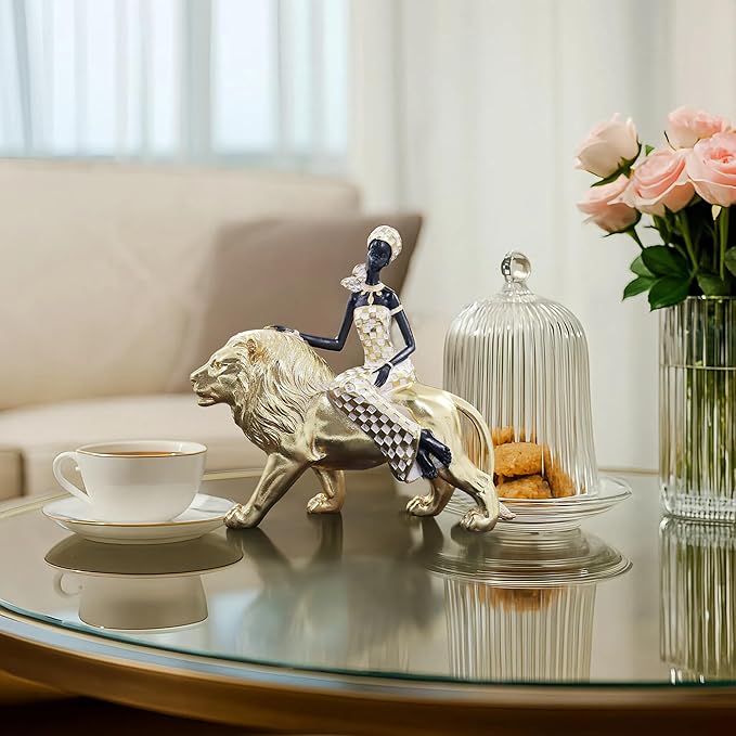 African Woman Riding Lion Statue – Gold Resin Sculpture for Home Decor, African Queen Figurine with Tribal Pattern, Cultural Art Decor for Living Room, Shelf, Office, or Gift